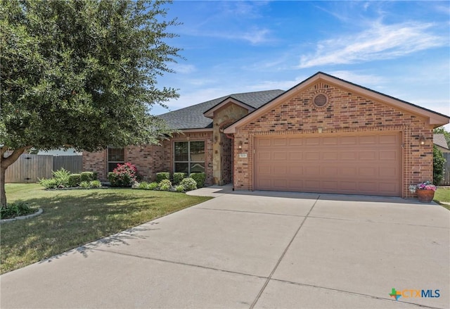 519 Gianotti Ct, Temple, TX 76502 - ranch-style house featuring brick siding, an attached garage, driveway, and a shingled roof