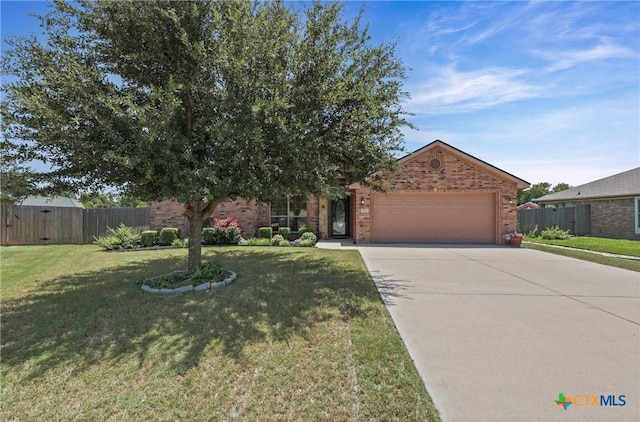 519 Gianotti Ct, Temple, TX 76502 - obstructed view of property featuring brick siding, a garage, and concrete driveway
