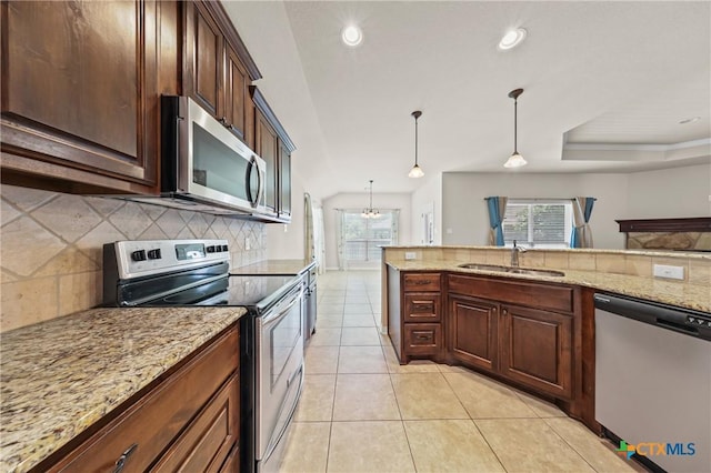 519 Gianotti Ct, Temple, TX 76502 - kitchen featuring stainless steel appliances, tasteful backsplash, light stone countertops, pendant lighting, and light tile patterned floors