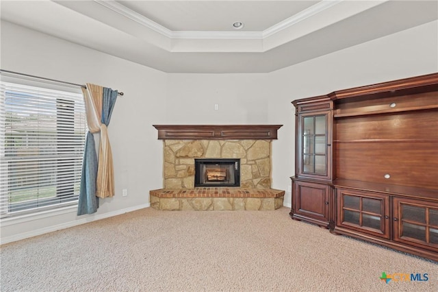 519 Gianotti Ct, Temple, TX 76502 - carpeted living area with plenty of natural light, a stone fireplace, crown molding, and a raised ceiling