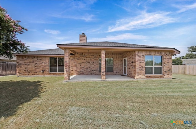 519 Gianotti Ct, Temple, TX 76502 - back of house featuring brick siding, a chimney, and a patio area