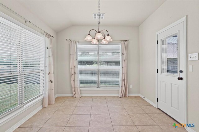 519 Gianotti Ct, Temple, TX 76502 - unfurnished dining area with plenty of natural light, a chandelier, light tile patterned flooring, and vaulted ceiling
