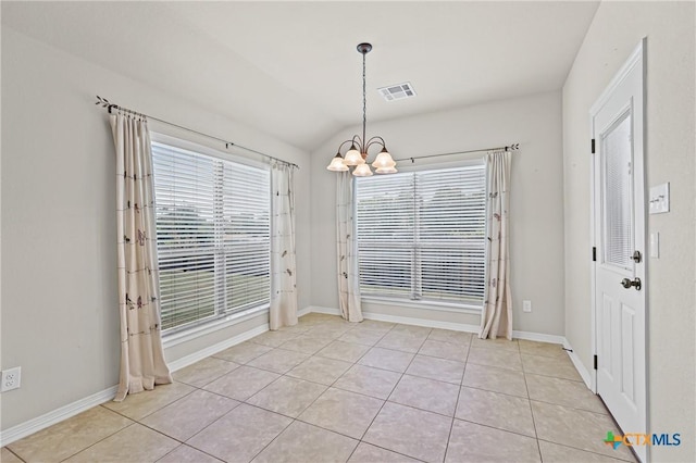 519 Gianotti Ct, Temple, TX 76502 - unfurnished dining area featuring a chandelier, light tile patterned floors, and lofted ceiling