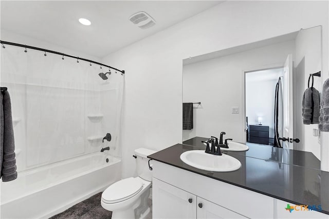 full bathroom with vanity, shower / tub combo, toilet, and visible vents