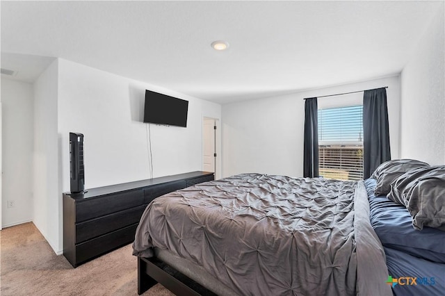 bedroom featuring light colored carpet