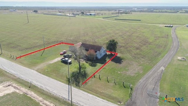 birds eye view of property with a rural view