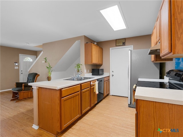 10619 Marshitahs Way, Austin, TX 78748 - kitchen featuring black appliances, light wood finished floors, a peninsula, and light countertops
