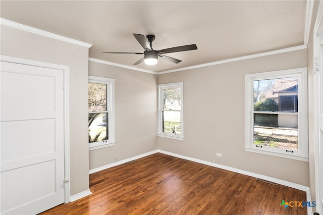 unfurnished room with crown molding, baseboards, ceiling fan, and wood finished floors