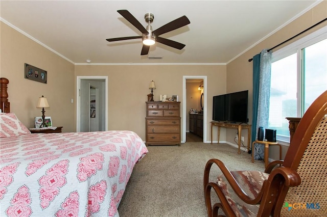 4417 S Pea Ridge Rd, Temple, TX 76502 - carpeted bedroom with ornamental molding, baseboards, ceiling fan, and ensuite bath