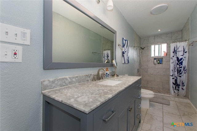 4417 S Pea Ridge Rd, Temple, TX 76502 - bathroom featuring toilet, vanity, a stall shower, and marble finish floors