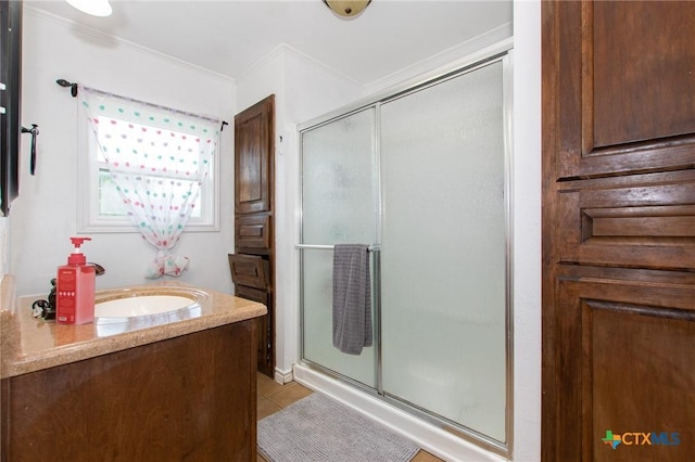 4417 S Pea Ridge Rd, Temple, TX 76502 - full bathroom with a stall shower, vanity, crown molding, and tile patterned flooring