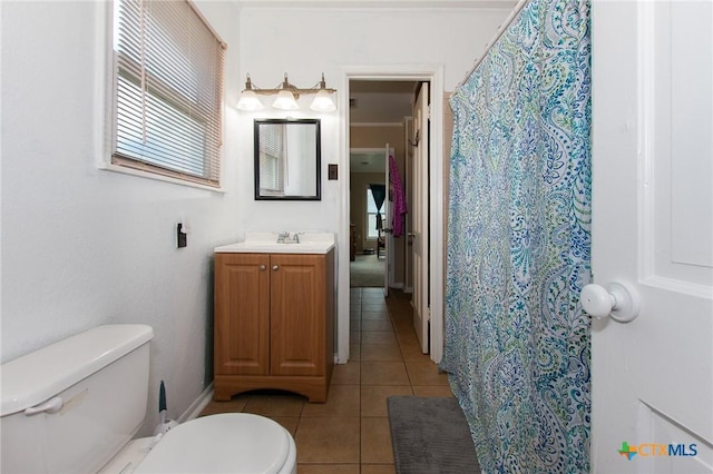 4417 S Pea Ridge Rd, Temple, TX 76502 - full bath featuring toilet, vanity, tile patterned floors, and healthy amount of natural light