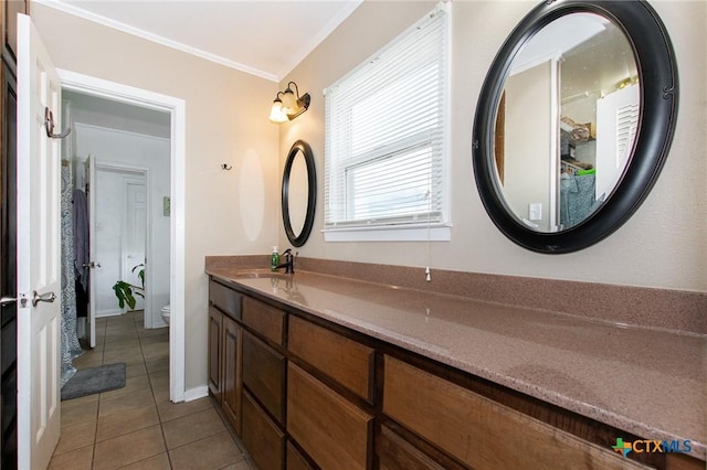 4417 S Pea Ridge Rd, Temple, TX 76502 - bathroom featuring toilet, tile patterned floors, double vanity, and ornamental molding