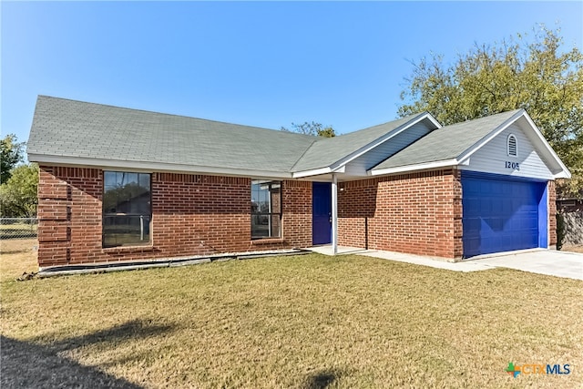 single story home featuring a garage and a front lawn