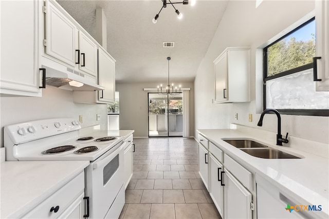 kitchen with white cabinets, sink, hanging light fixtures, electric range, and a notable chandelier