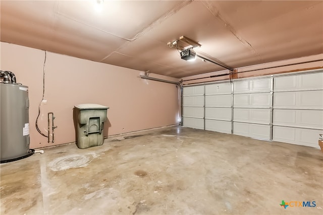 garage with a garage door opener and water heater