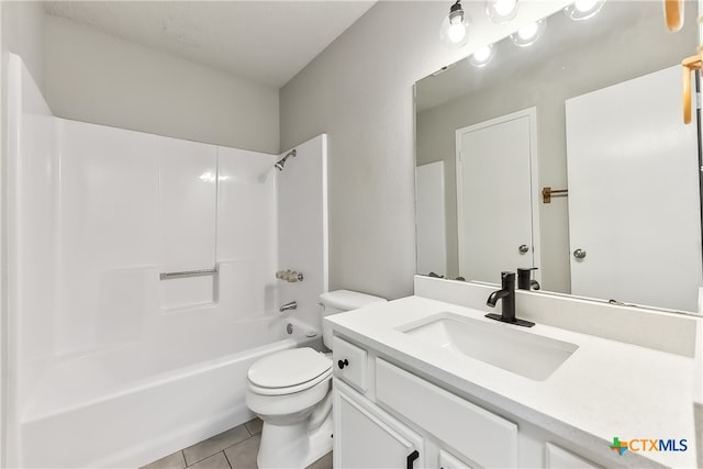 full bathroom with washtub / shower combination, vanity, tile patterned floors, and toilet