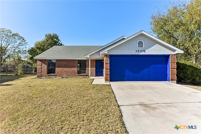 single story home with a front yard and a garage