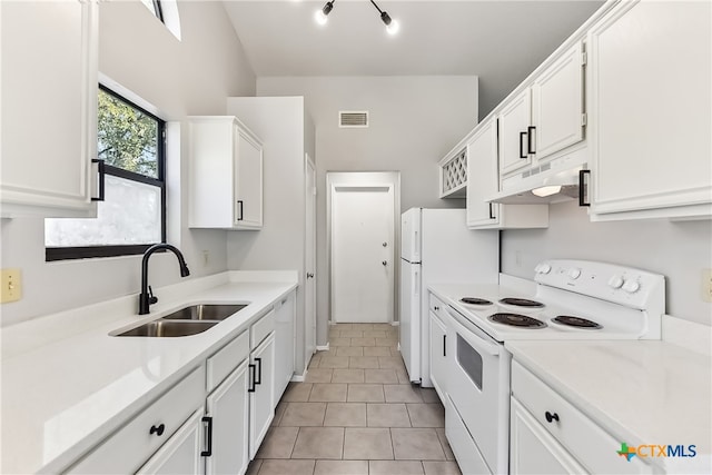 kitchen featuring white cabinetry, white appliances, sink, and light tile patterned floors