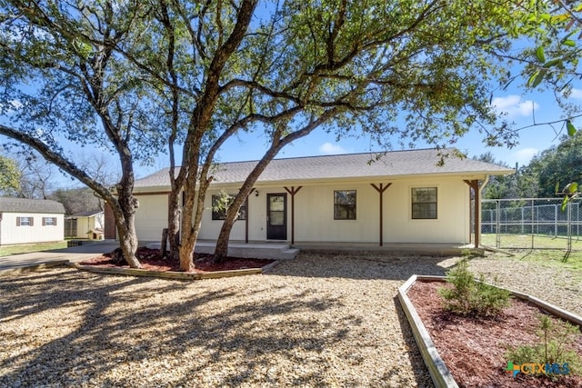 ranch-style home with an attached garage, fence, and driveway