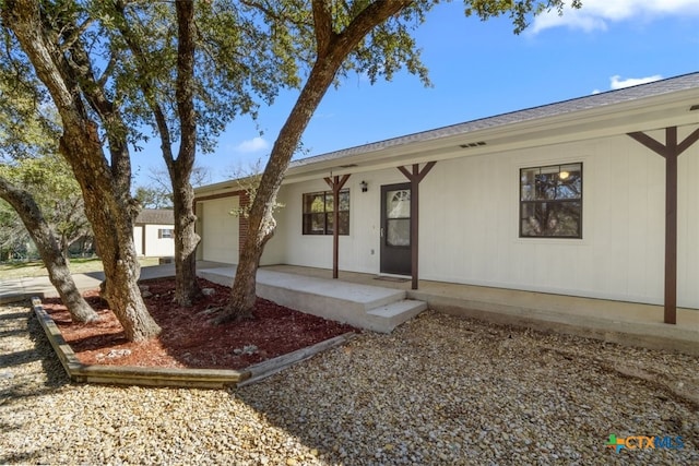 view of front of property with covered porch and an attached garage