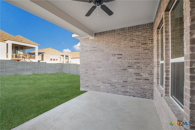 view of patio featuring ceiling fan