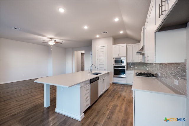 kitchen with stainless steel appliances, sink, dark hardwood / wood-style floors, an island with sink, and white cabinets