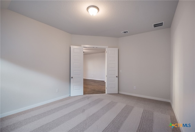 unfurnished bedroom featuring carpet floors