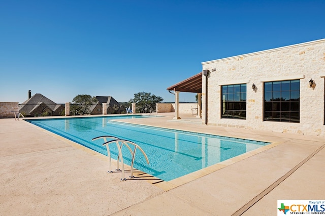 view of pool with a patio