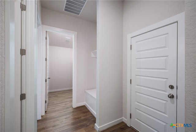 hall featuring dark wood-type flooring