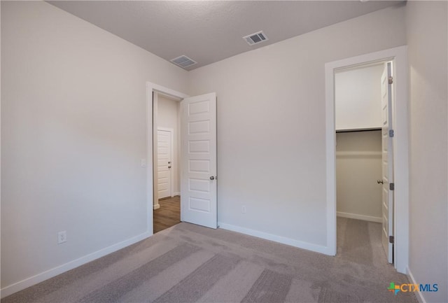 584 Tobacco Pass, New Braunfels, TX 78132 - unfurnished bedroom featuring carpet floors, baseboards, visible vents, and a spacious closet