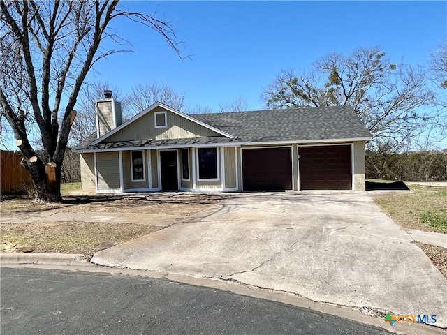 single story home featuring a porch, a garage, a shingled roof, driveway, and a chimney