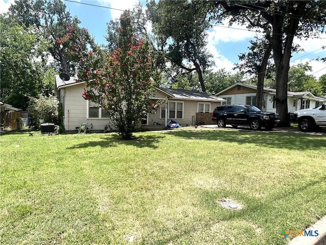 613 E 5th St, Cameron, TX 76520 - view of front facade featuring a front lawn and central AC