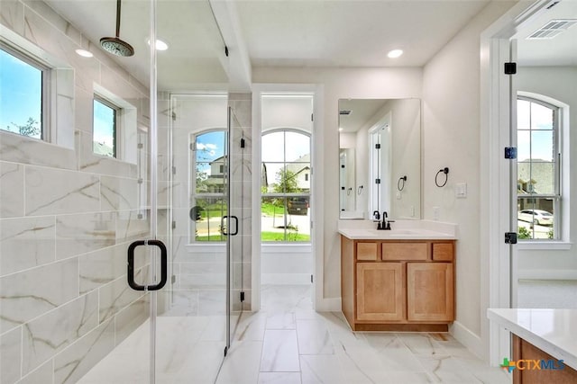 1826 Nettletree Rd, New Braunfels, TX 78132 - full bathroom featuring vanity, a stall shower, marble look tile flooring, and recessed lighting