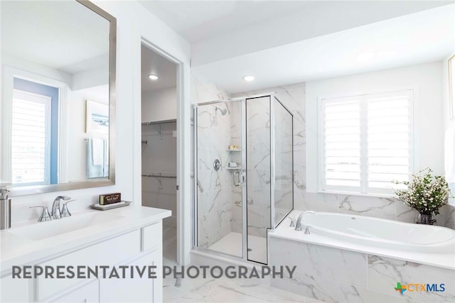 bathroom with a marble finish shower, marble look tiles, a bath, plenty of natural light, and recessed lighting