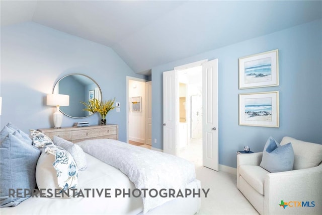 bedroom with lofted ceiling, carpet floors, and baseboards