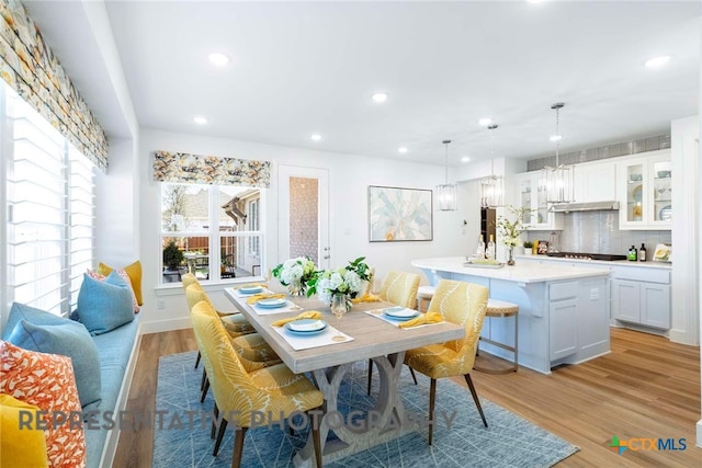 dining room featuring recessed lighting and light wood-style flooring