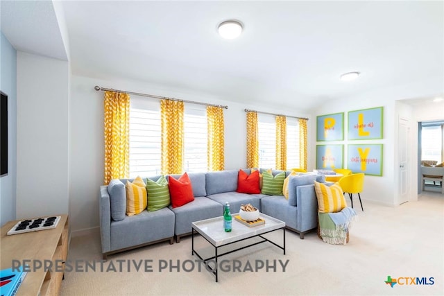 living room with carpet and baseboards