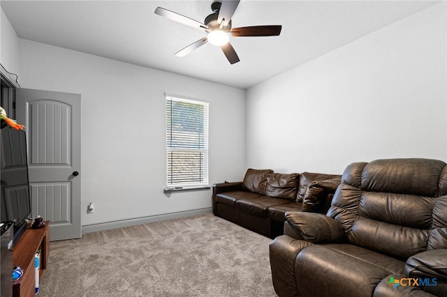 carpeted living room featuring ceiling fan