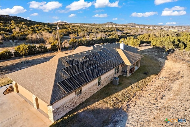 drone / aerial view featuring a mountain view