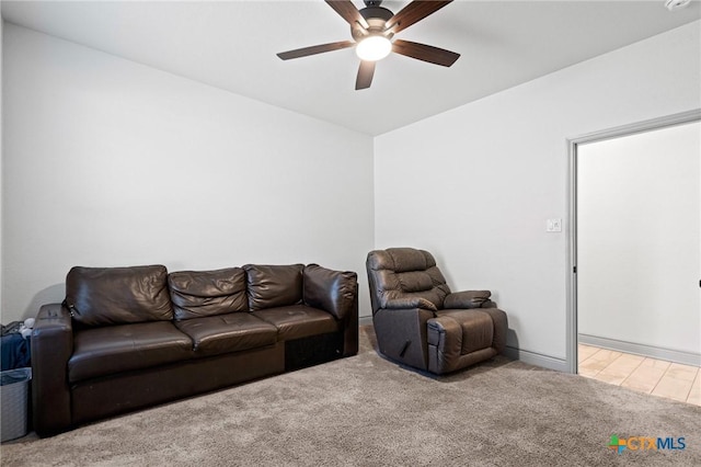 living room with light colored carpet and ceiling fan