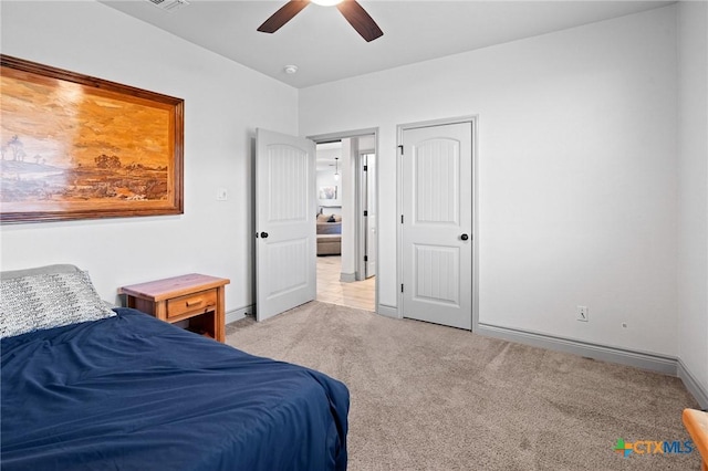 bedroom with light colored carpet and ceiling fan