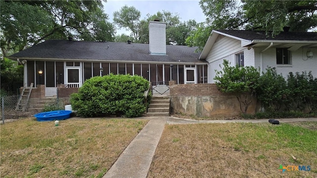 4002 El Capitan Dr, Temple, TX 76502 - view of front of home featuring a sunroom, brick siding, and a chimney