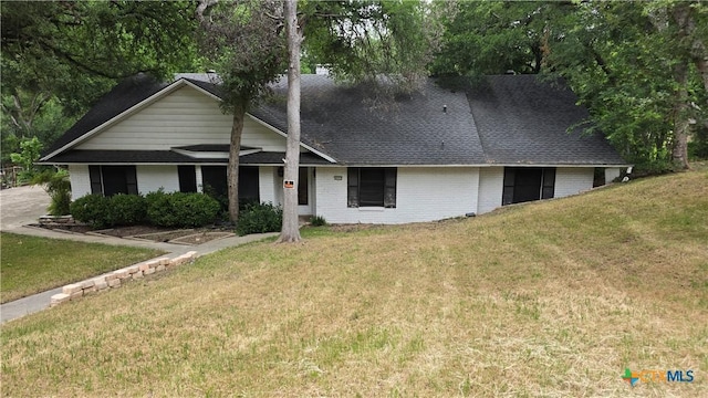 4002 El Capitan Dr, Temple, TX 76502 - view of front of property with brick siding, a front yard, and a shingled roof