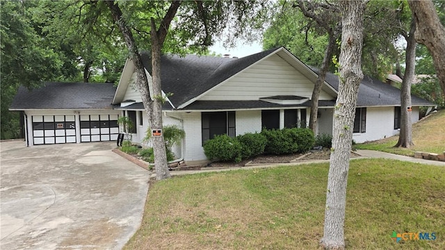 4002 El Capitan Dr, Temple, TX 76502 - view of front of house featuring an attached garage, driveway, a front yard, and brick siding