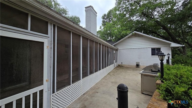 4002 El Capitan Dr, Temple, TX 76502 - view of patio / terrace with a sunroom and a grill