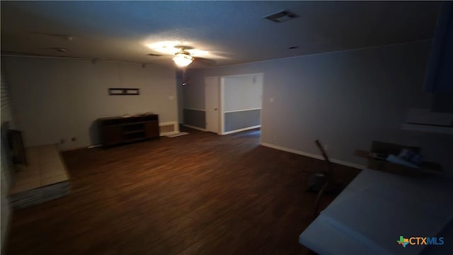 4002 El Capitan Dr, Temple, TX 76502 - unfurnished living room with dark wood-type flooring and baseboards