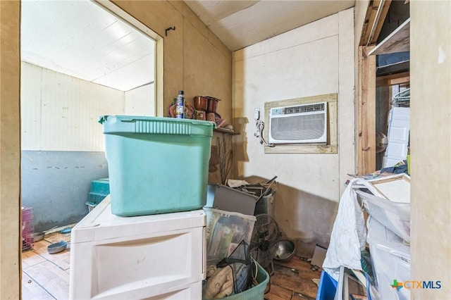401 Walnut St, Hallettsville, TX 77964 - miscellaneous room with a wall mounted air conditioner, wood finished floors, and vaulted ceiling