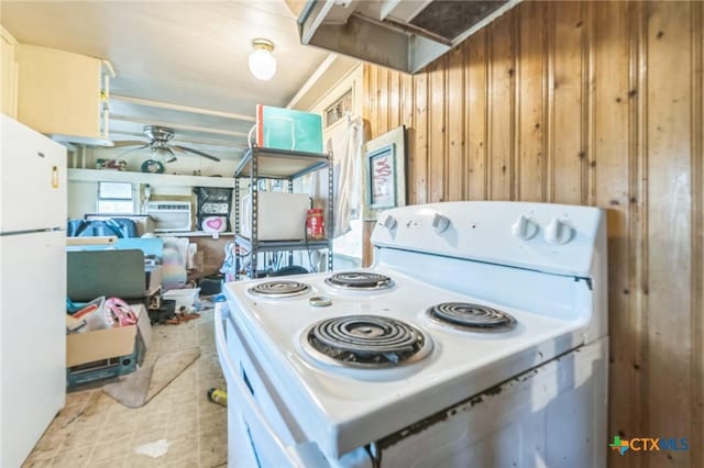 401 Walnut St, Hallettsville, TX 77964 - kitchen with white appliances, a ceiling fan, and wooden walls