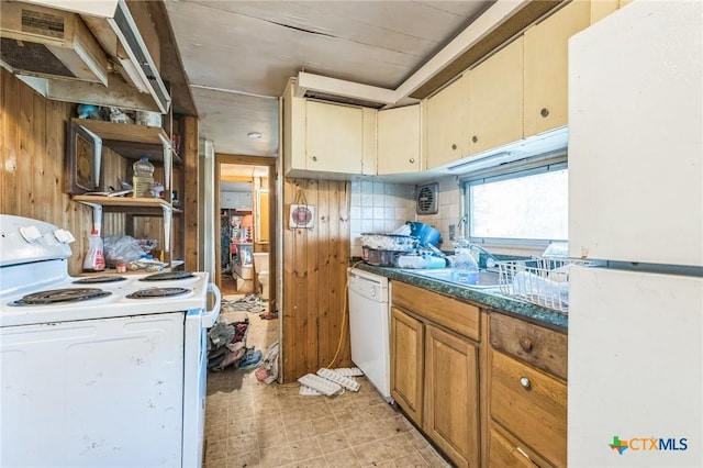 401 Walnut St, Hallettsville, TX 77964 - kitchen featuring white appliances, light flooring, backsplash, and dark countertops